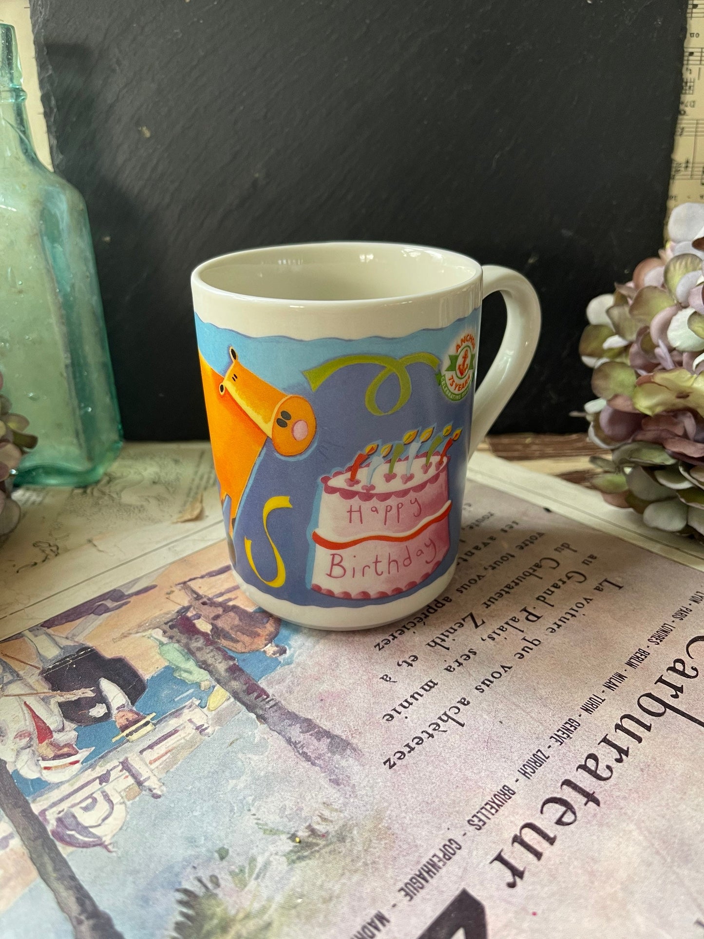 Anchor 75th Anniversary Commemorative Mug with Cow and Birthday Cake Design