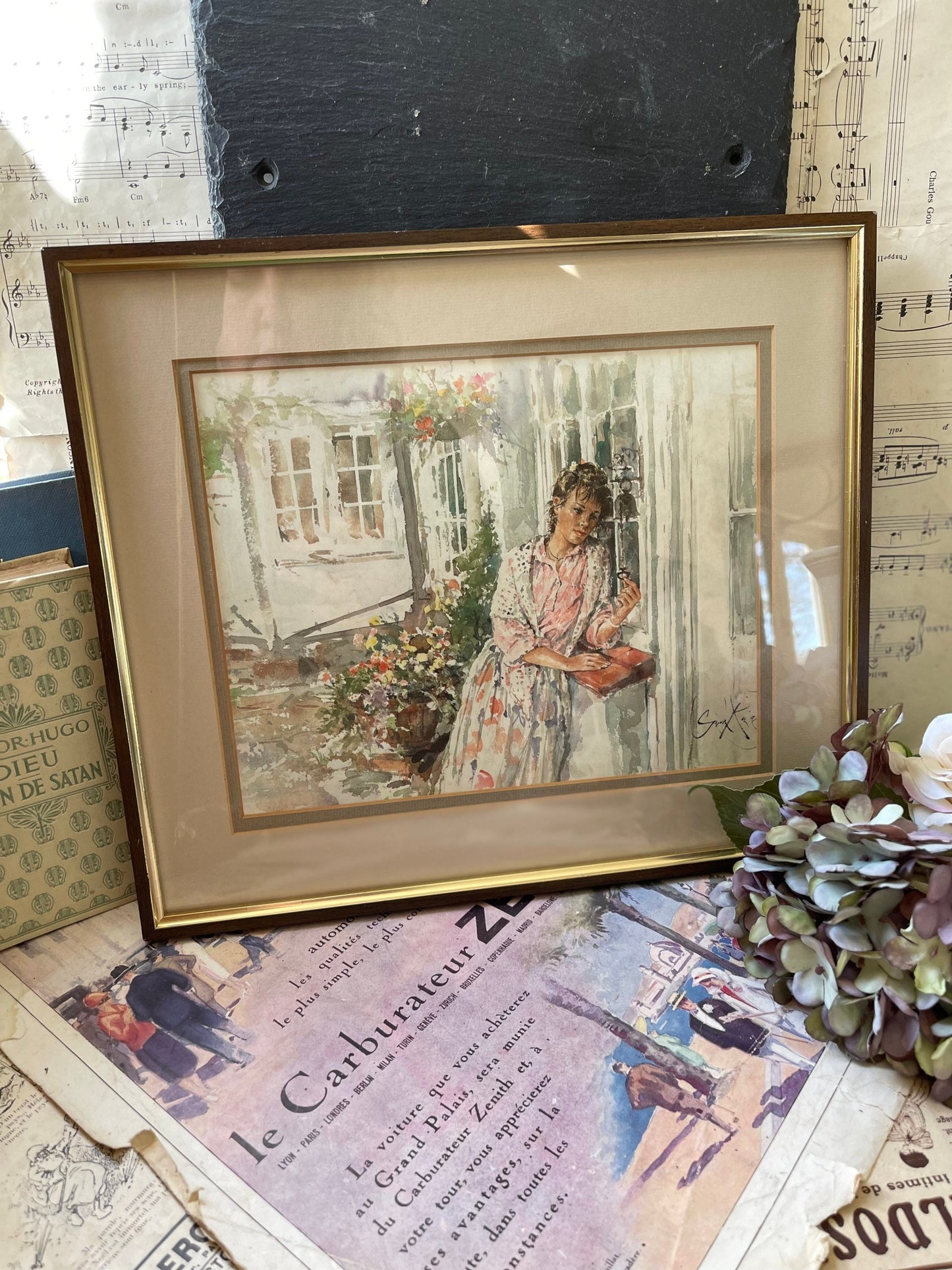 Framed Print of a Watercolour of a Young Woman in a Dress in a Garden