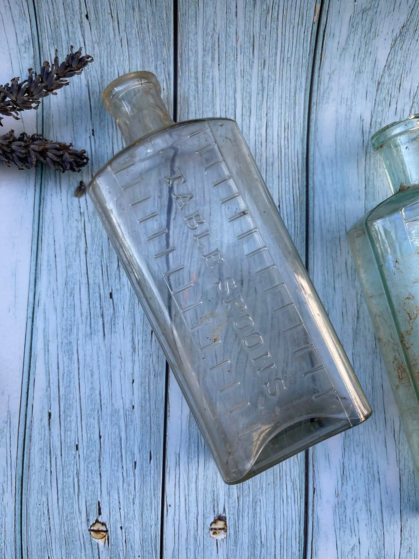 Three Vintage Clear Medicine Bottles with Teaspoon and Tablespoon Measures